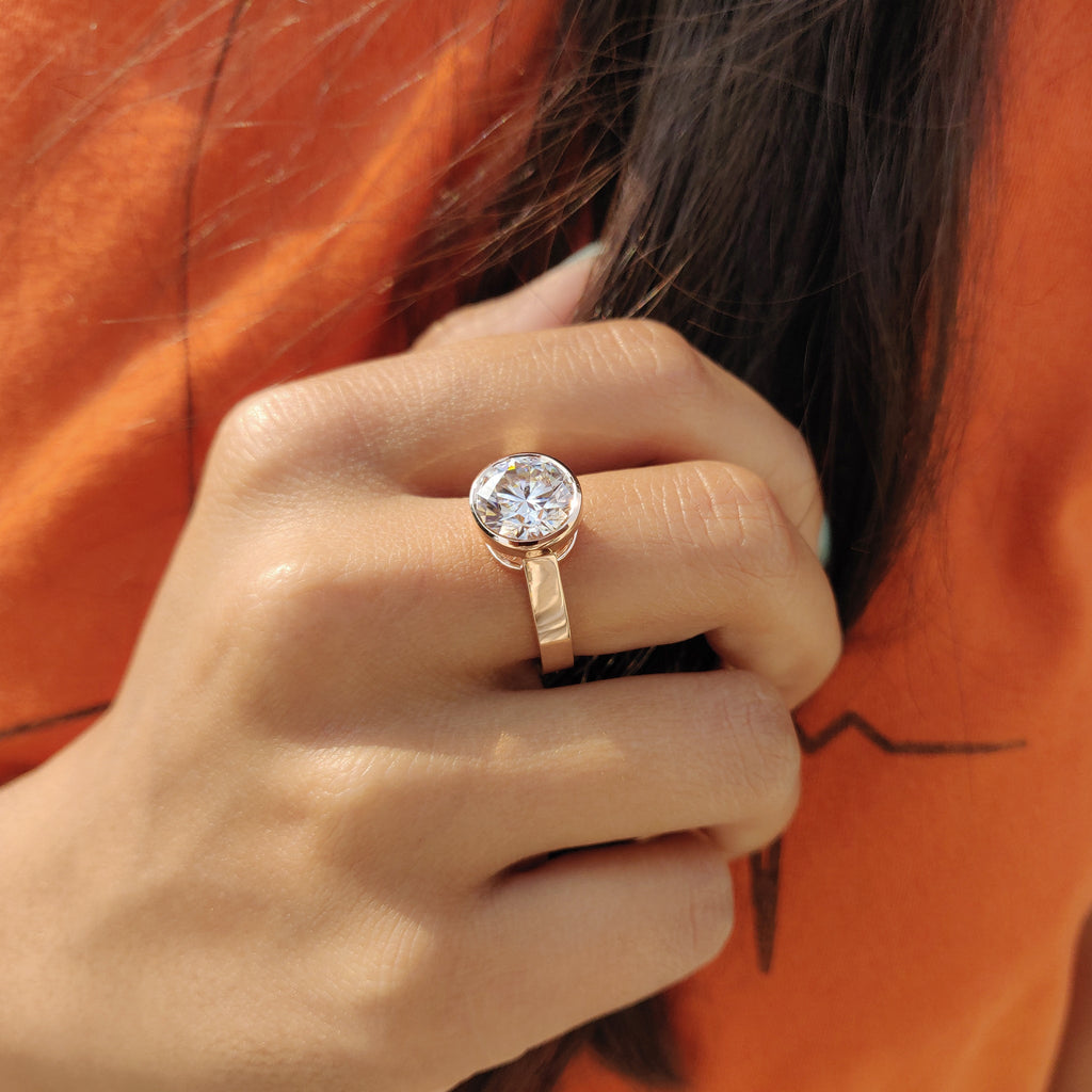 Round Cut Bezel Set Moissanite Ring