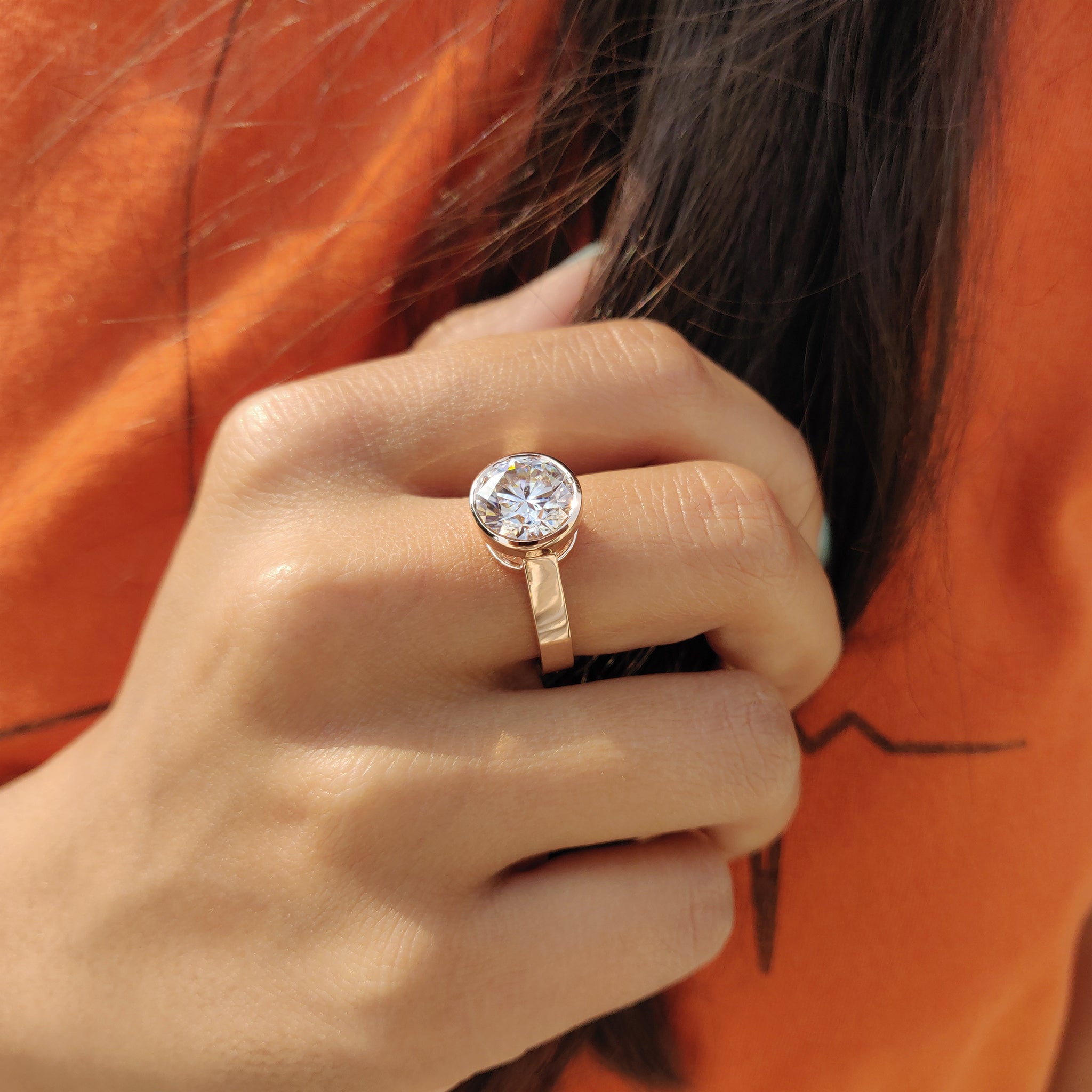 Round Cut Bezel Set Moissanite Ring