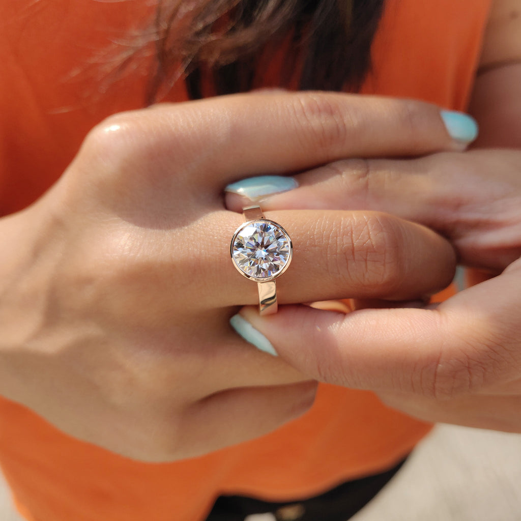 Round Cut Bezel Set Moissanite Ring