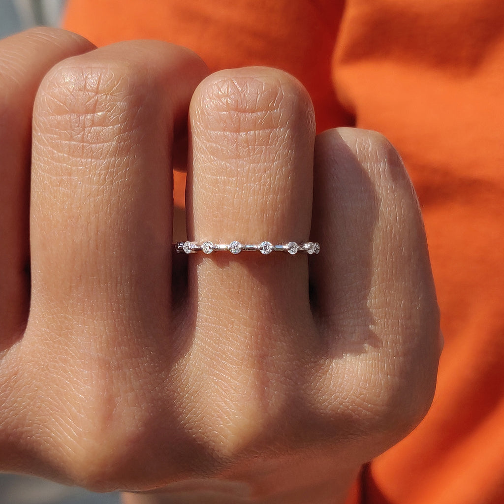 Round Moissanite Wedding Band In Distance Pave Setting