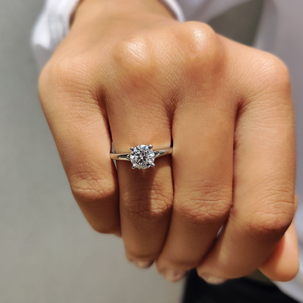 Round Solitaire Engagement Ring In Cathedral Setting