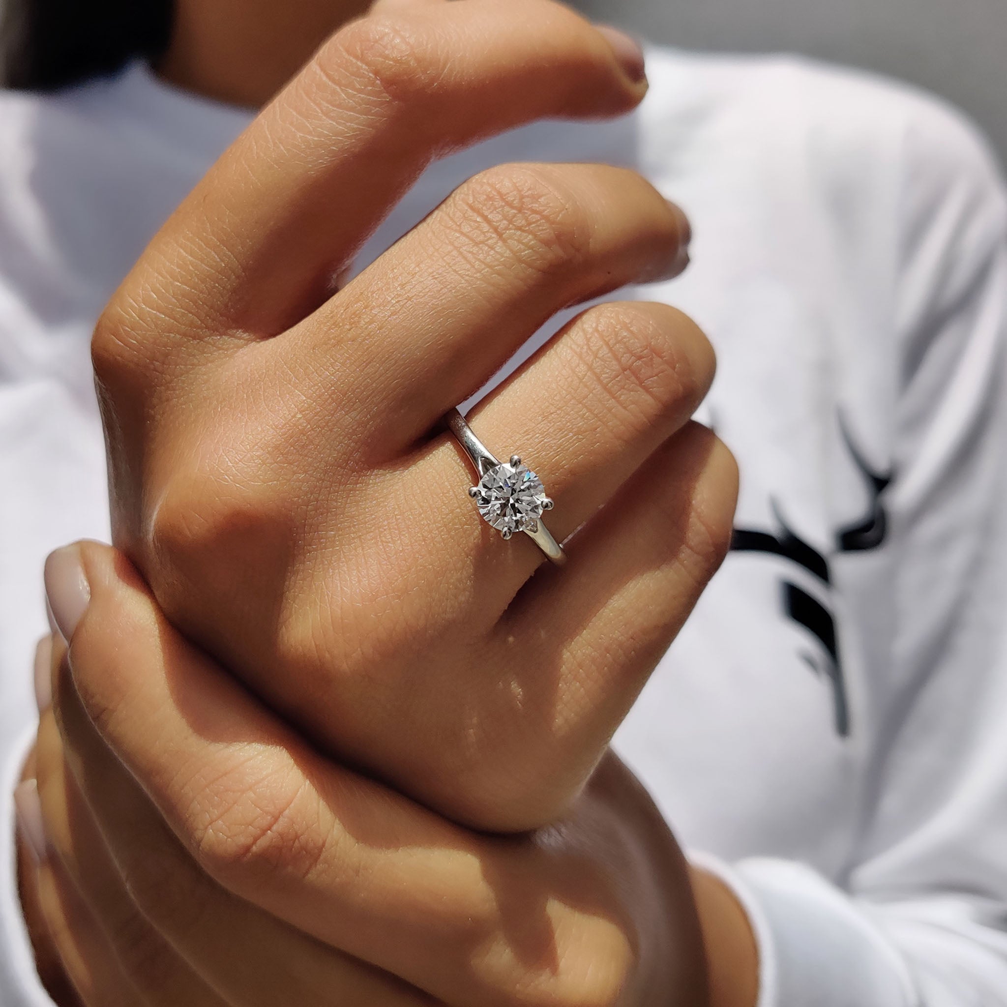 Round Solitaire Engagement Ring In Cathedral Setting