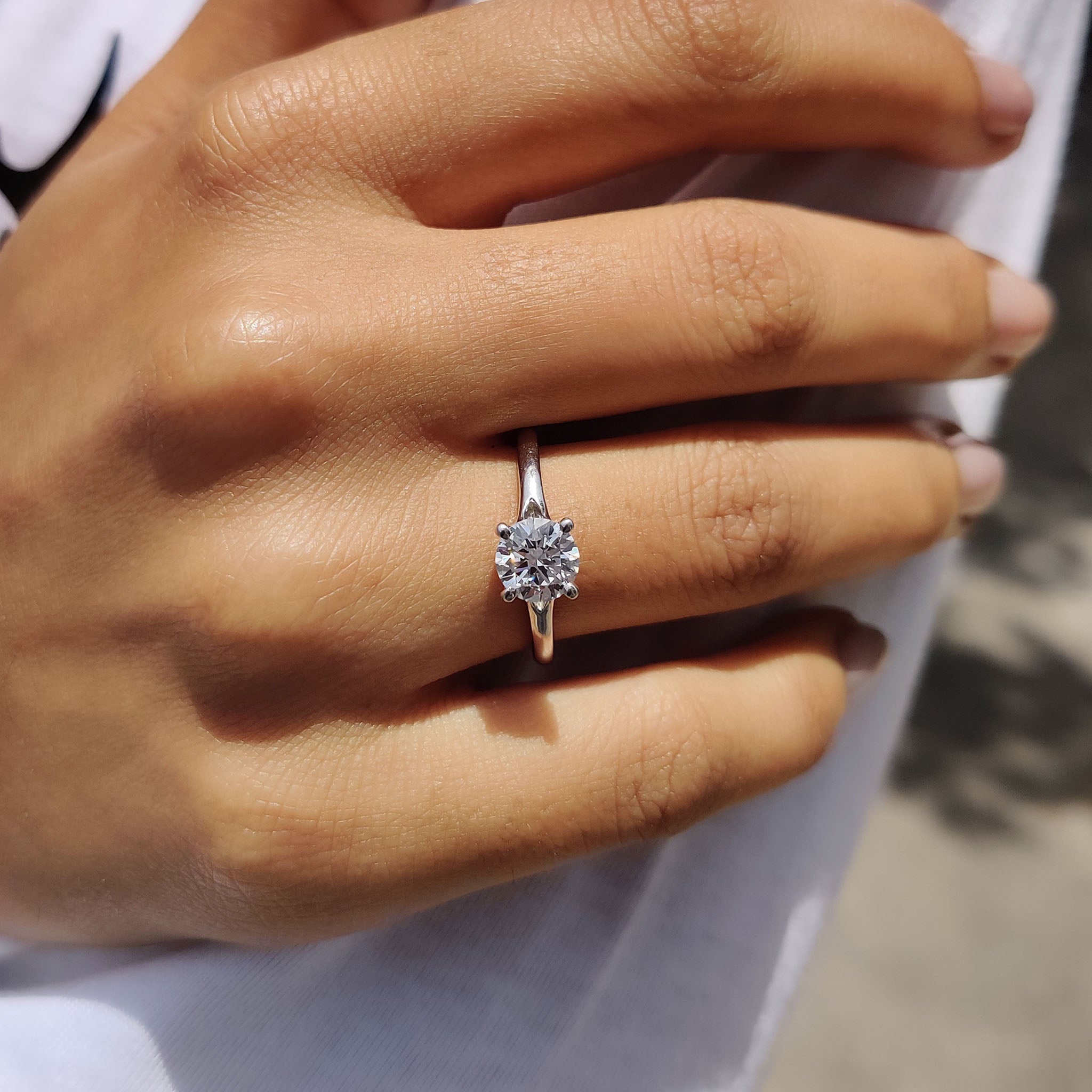 Round Solitaire Engagement Ring In Cathedral Setting