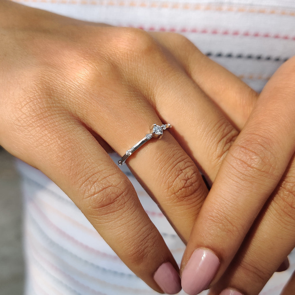 Delicate Distance Pave Wedding Band In Round Cut Moissanite