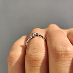 Delicate Distance Pave Wedding Band In Round Cut Moissanite