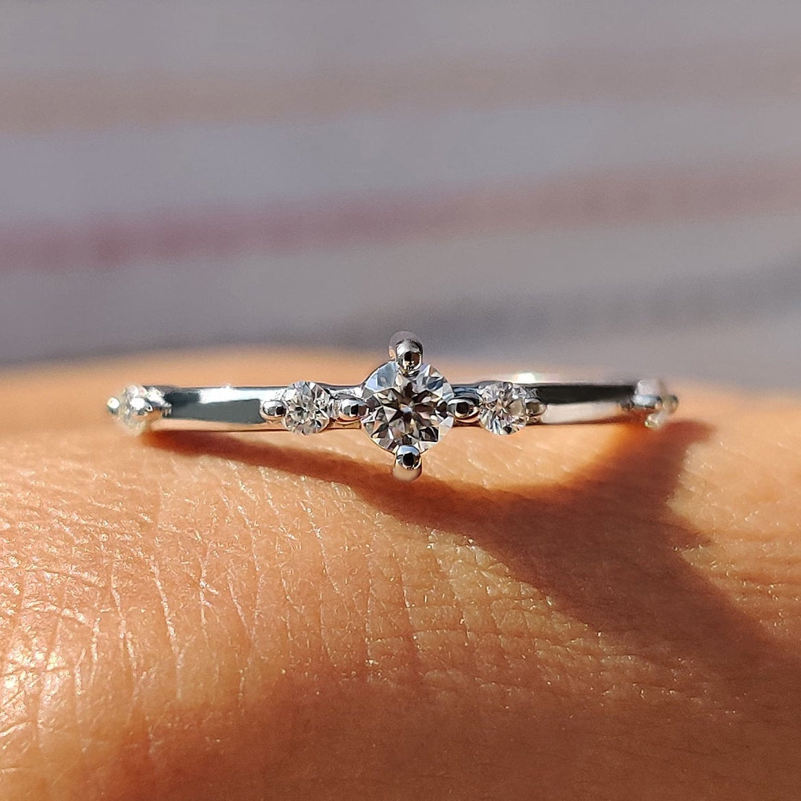 Delicate Distance Pave Wedding Band In Round Cut Moissanite Imagen principal del producto