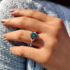 Cyan Blue Moissanite Oval Side Stone Engagement Ring