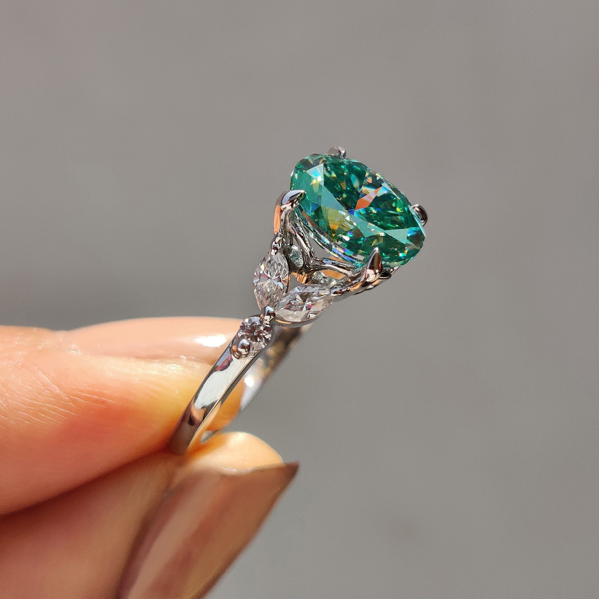 Cyan Blue Moissanite Oval Side Stone Engagement Ring