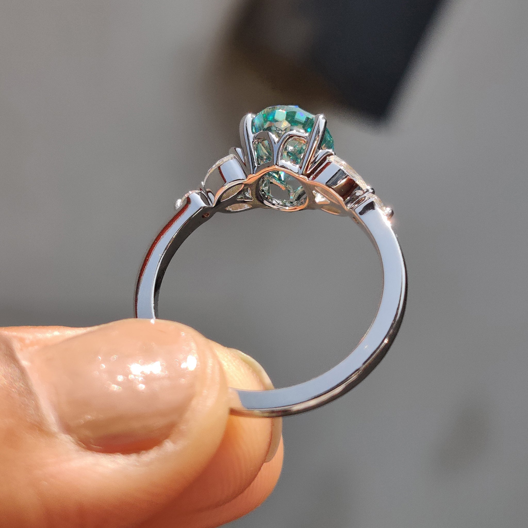 Cyan Blue Moissanite Oval Side Stone Engagement Ring