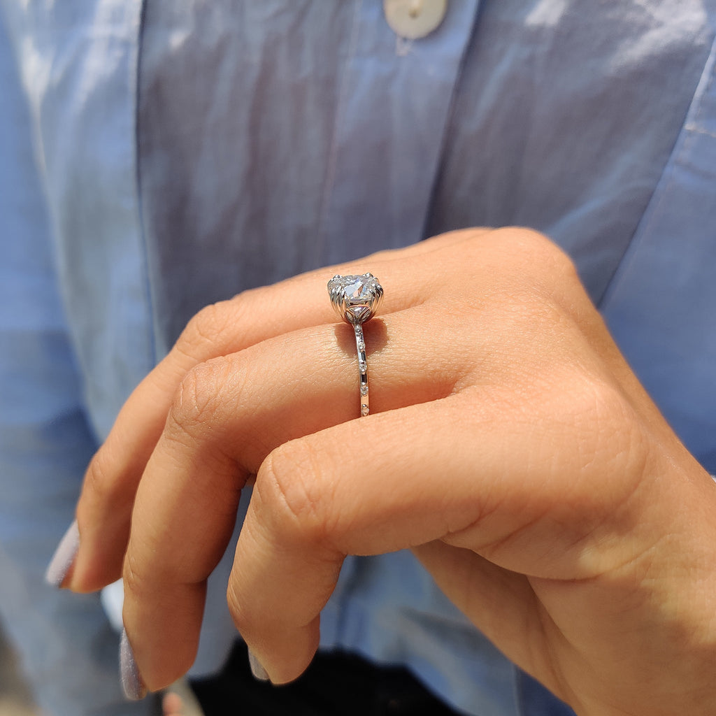 Round Cut Engagement Ring With Distance Pave Band