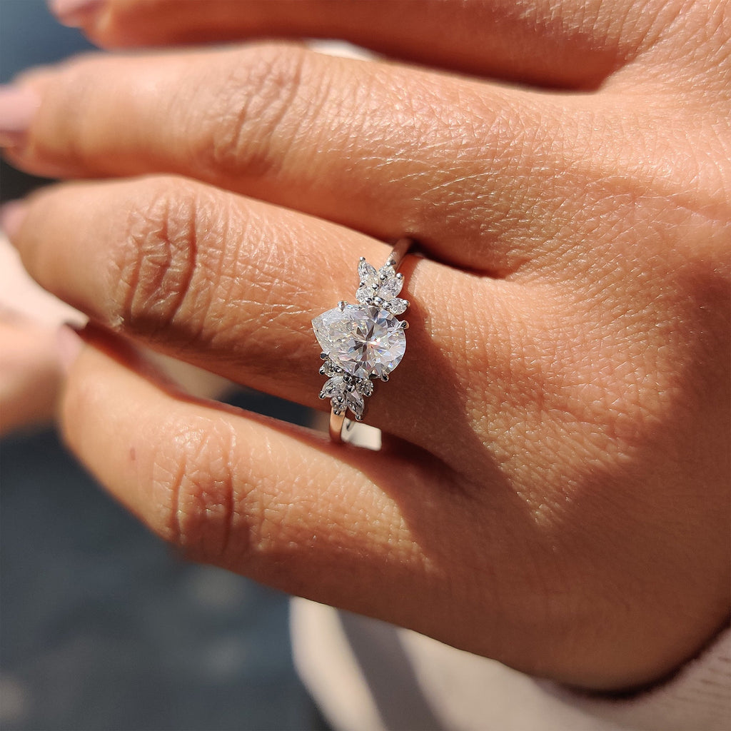 Moissanite Pear Ring With Marquise And Round Cut Side Stone