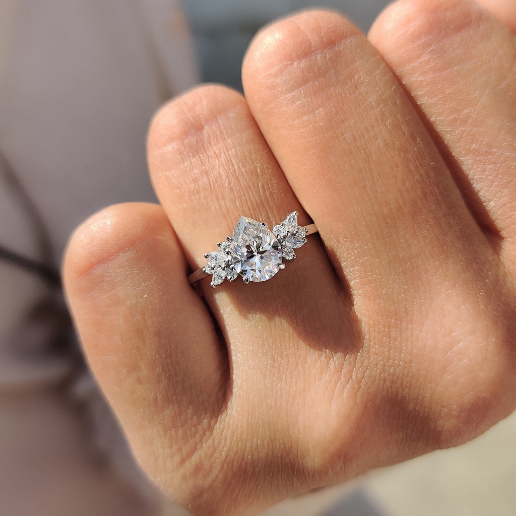 Moissanite Pear Ring With Marquise And Round Cut Side Stone