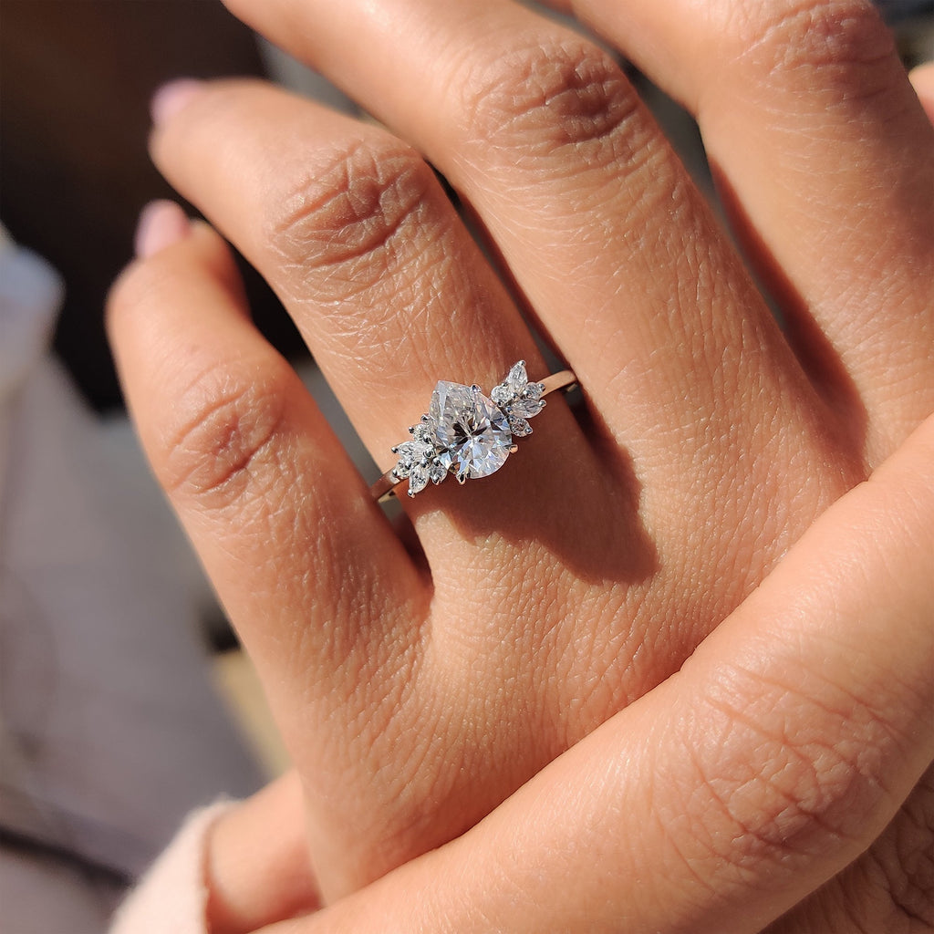 Moissanite Pear Ring With Marquise And Round Cut Side Stone