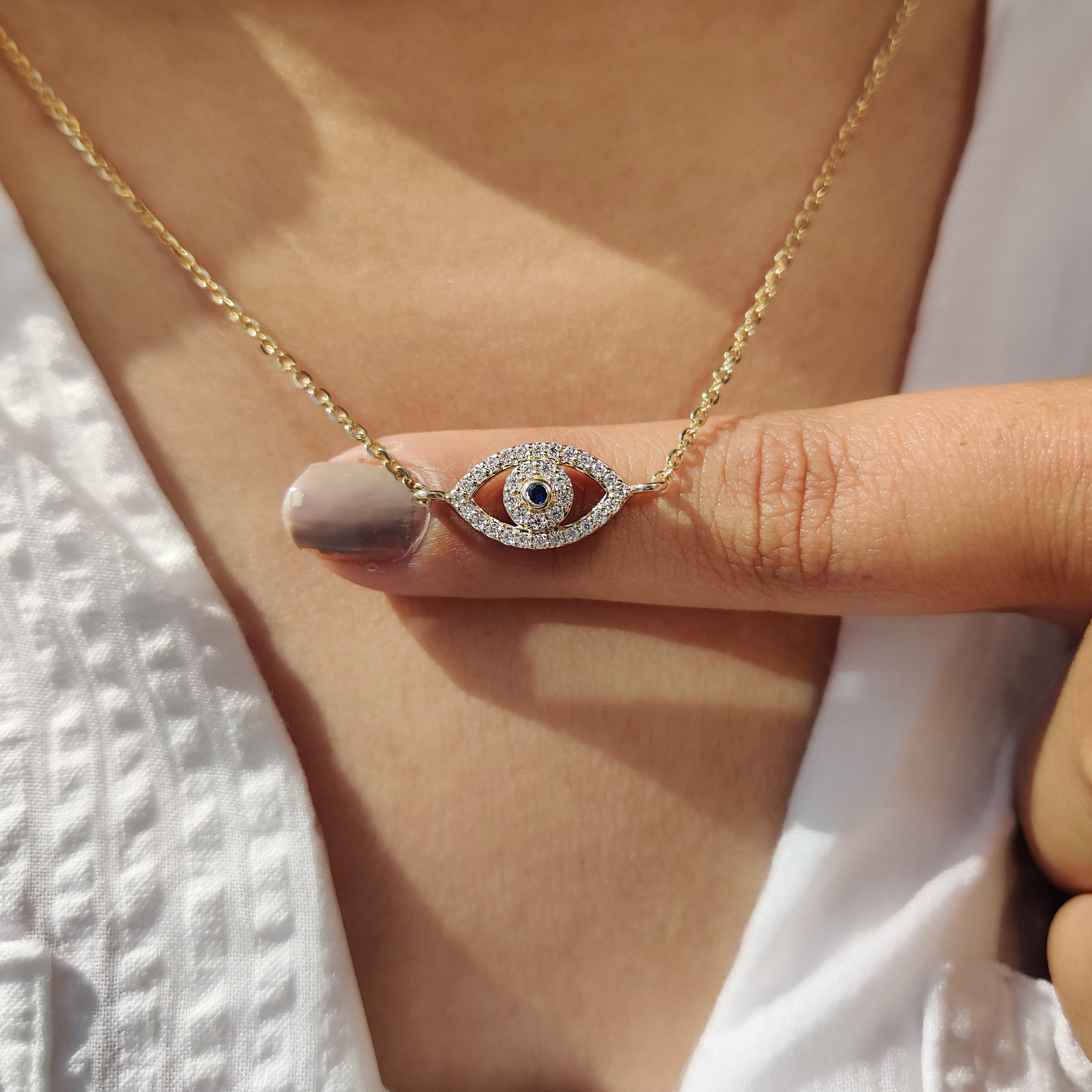 Round Cut Eye Shape Blue Diamond Pendant With Chain