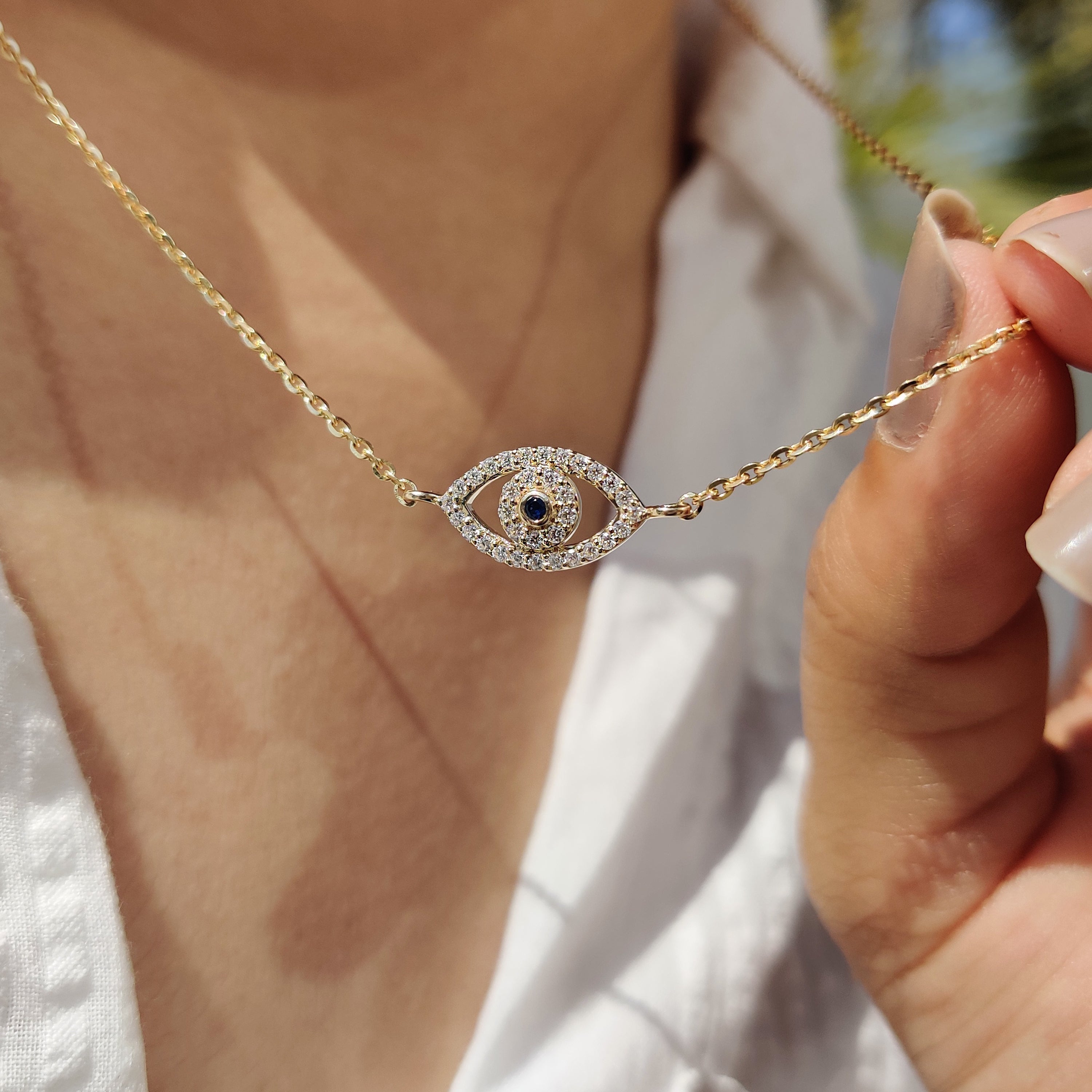 Round Cut Eye Shape Blue Diamond Pendant With Chain