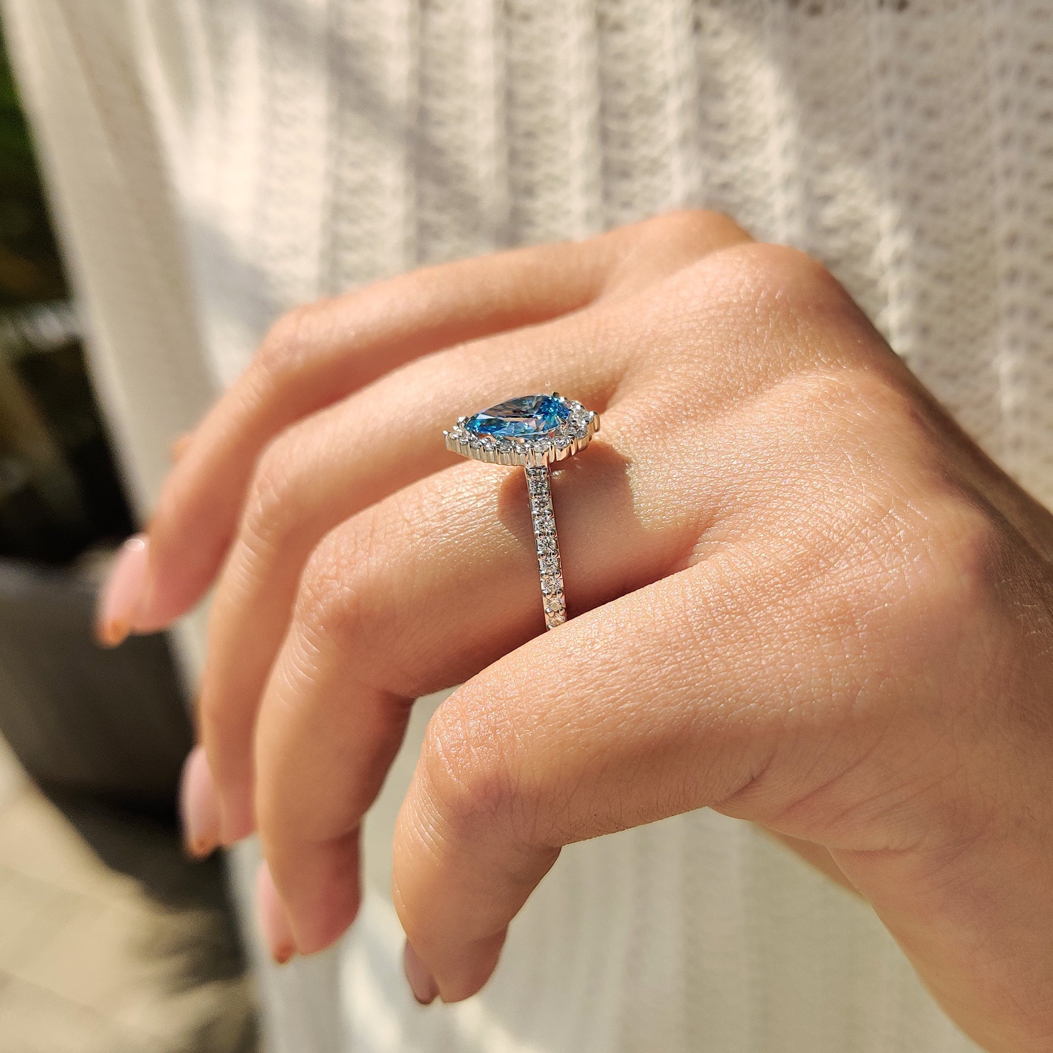 Cyan Blue Pear Diamond Ring In cathedral setting