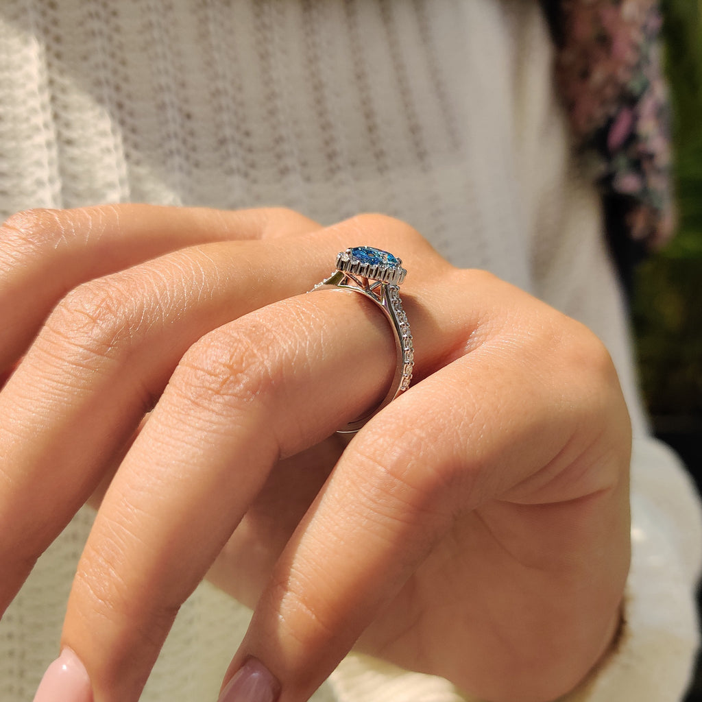 Cyan Blue Pear Diamond Ring In cathedral setting