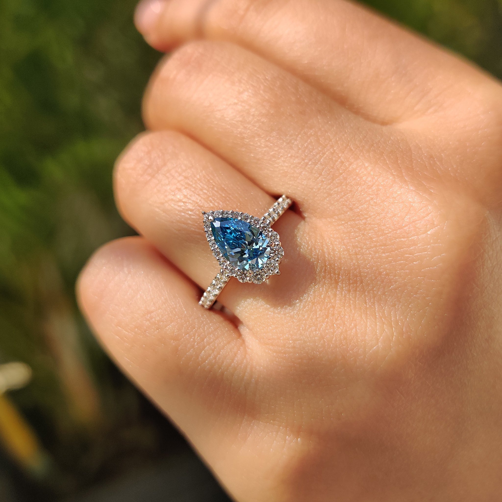 Cyan Blue Pear Diamond Ring In cathedral setting