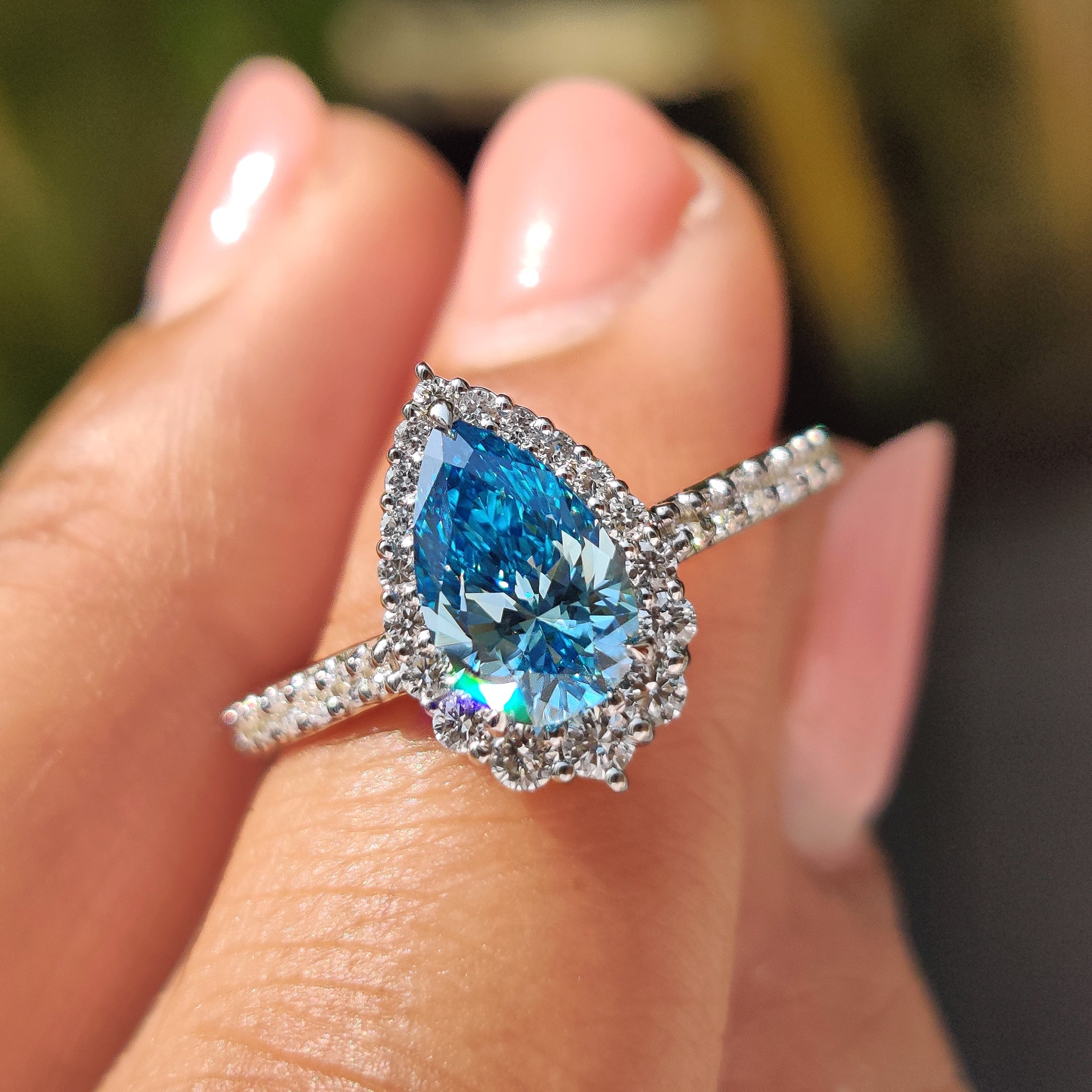 Cyan Blue Pear Diamond Ring In cathedral setting