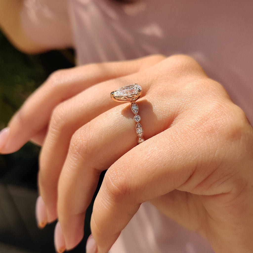 Pear Diamond Ring With Round Side Stone