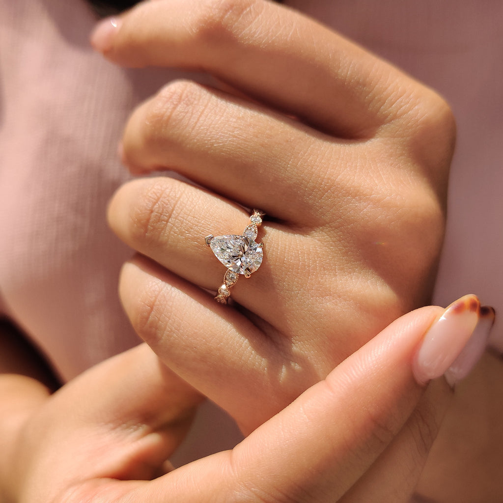 Pear Diamond Ring With Round Side Stone