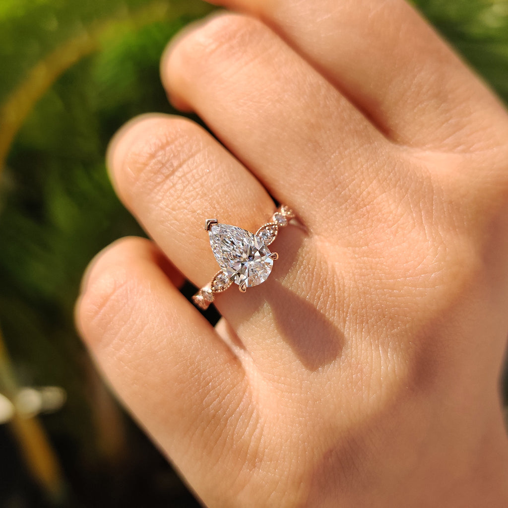Pear Diamond Ring With Round Side Stone