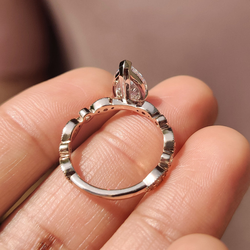 Pear Diamond Ring With Round Side Stone