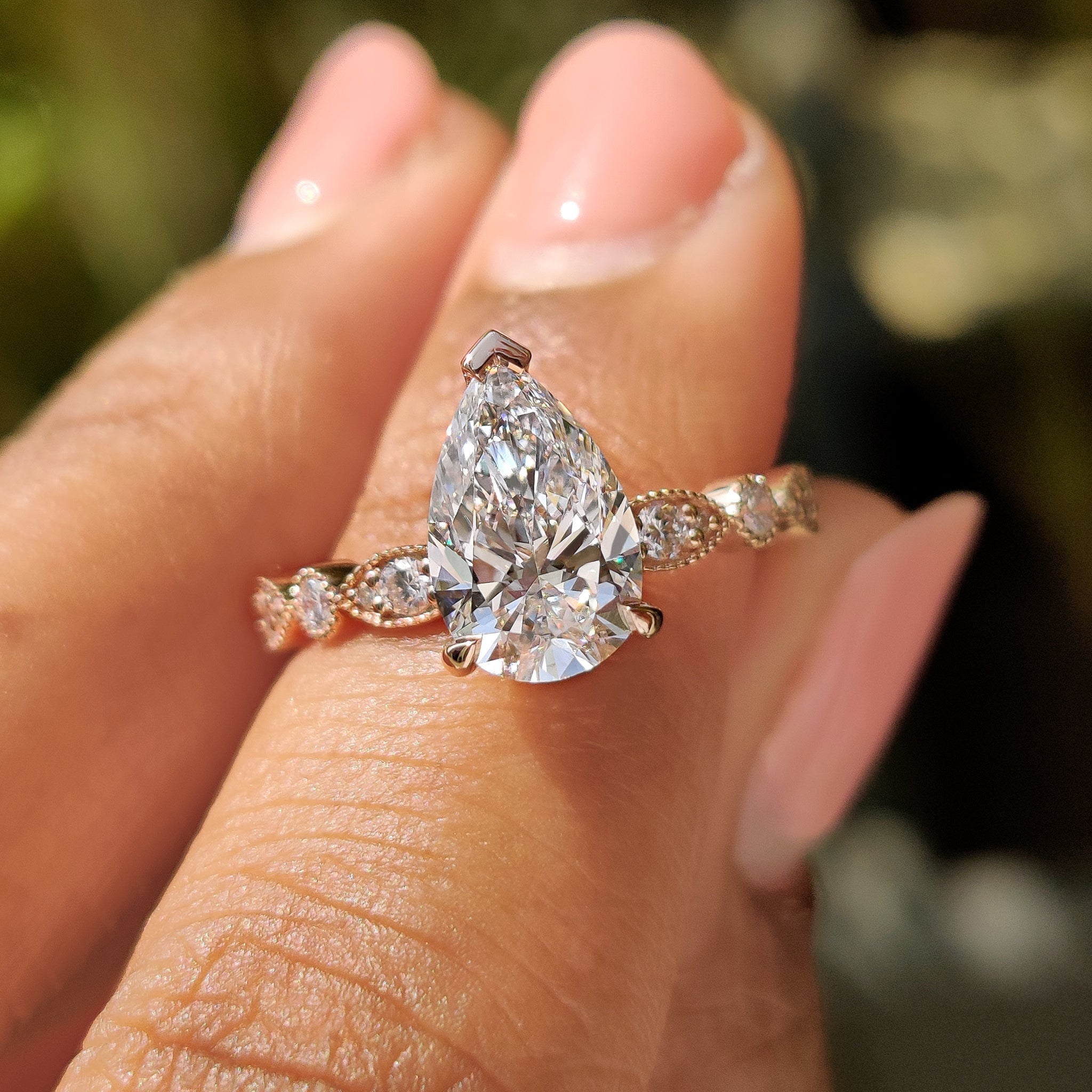 Pear Diamond Ring With Round Side Stone Main image