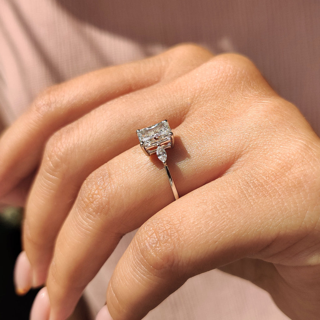 Radiant Cut Diamond Ring With Marquise Side Stone