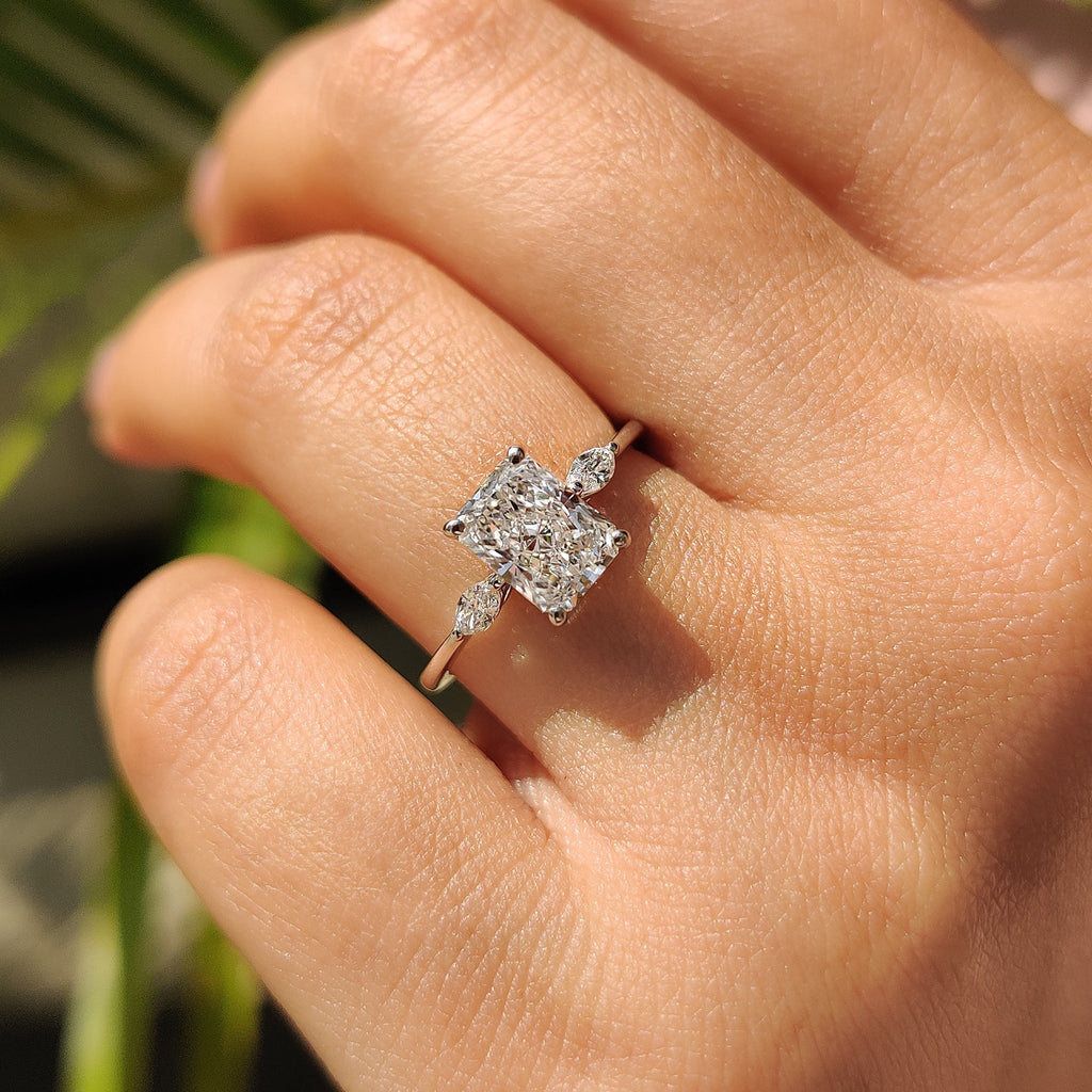Radiant Cut Diamond Ring With Marquise Side Stone