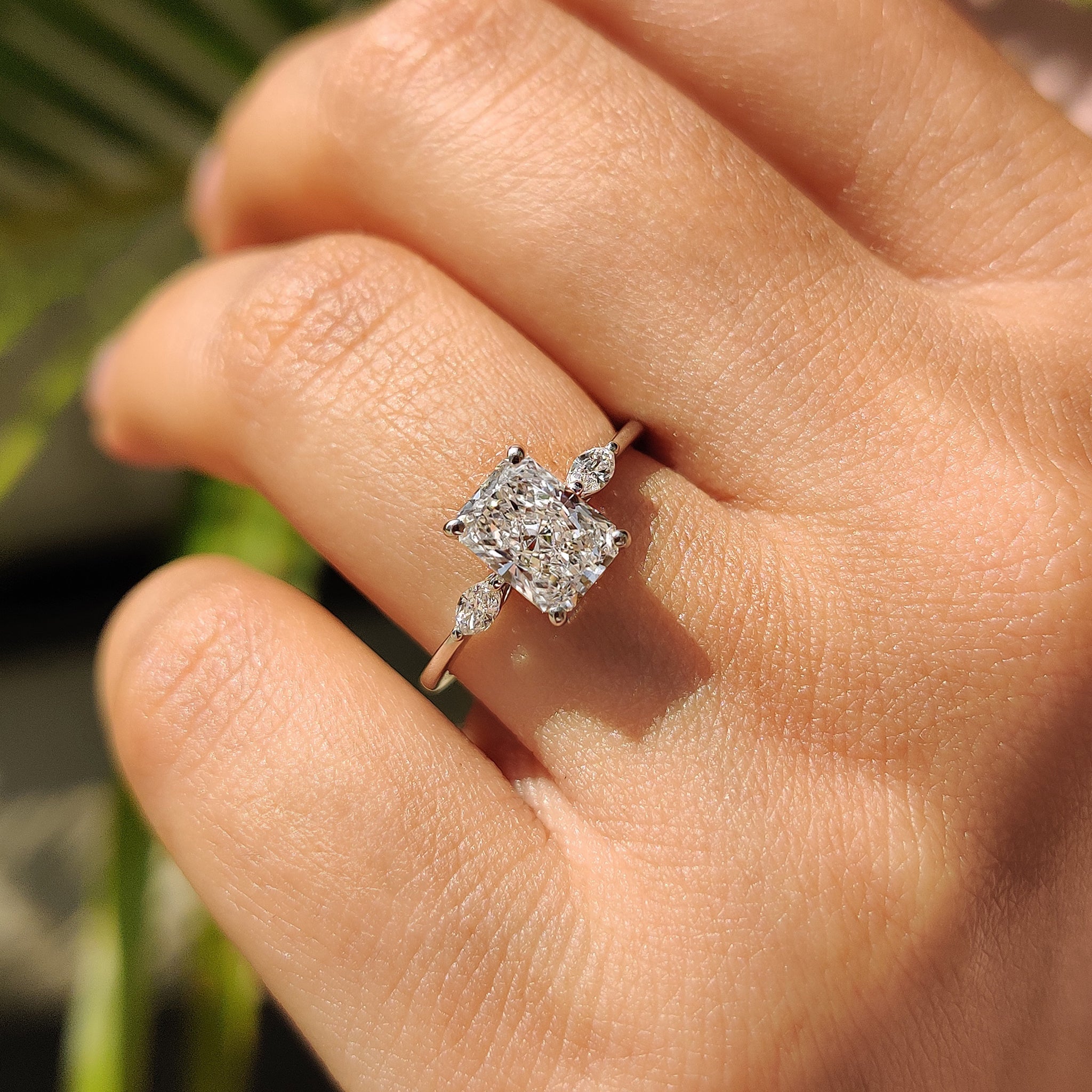 Radiant Cut Diamond Ring With Marquise Side Stone