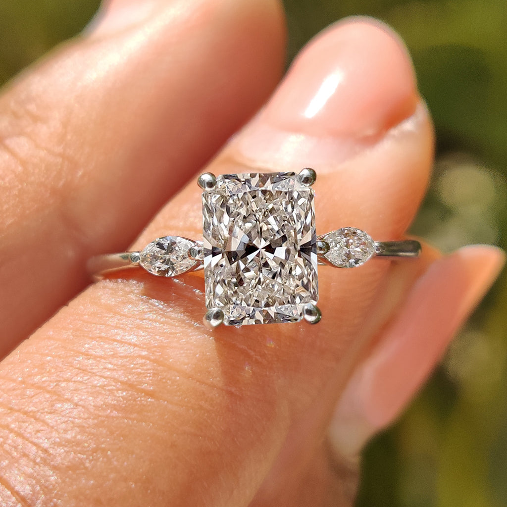 Radiant Cut Diamond Ring With Marquise Side Stone