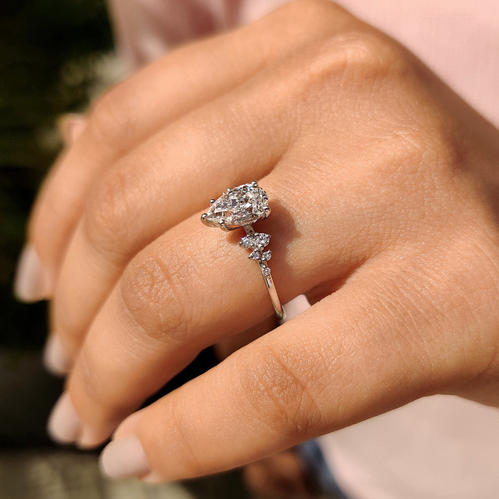 Pear Cluster Diamond Ring With Round Side Stone