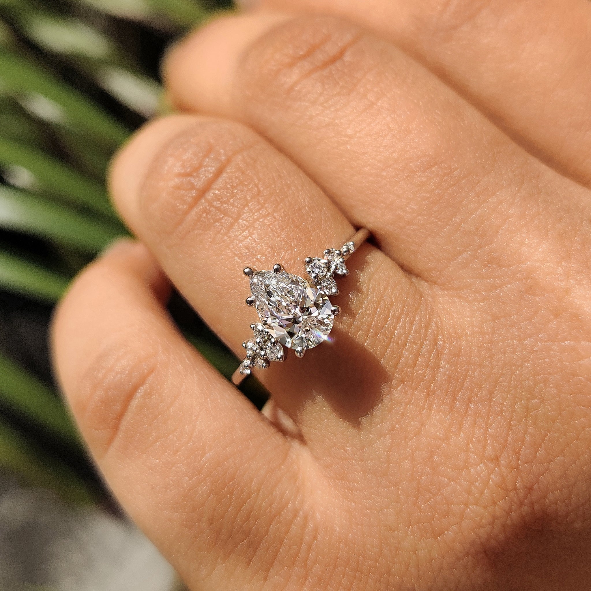 Pear Cluster Diamond Ring With Round Side Stone