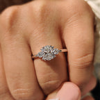 Oval Diamond Ring With Round Cut Side Stone