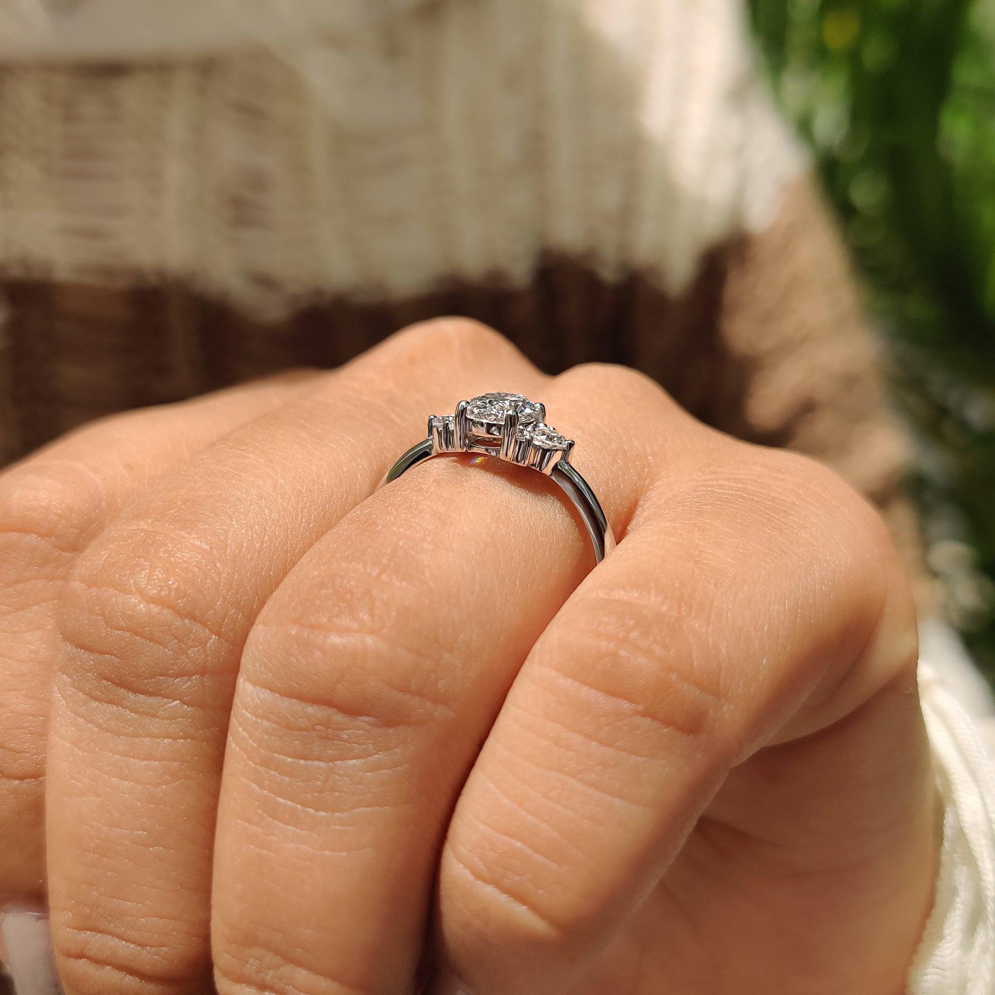 Oval Diamond Ring With Round Cut Side Stone