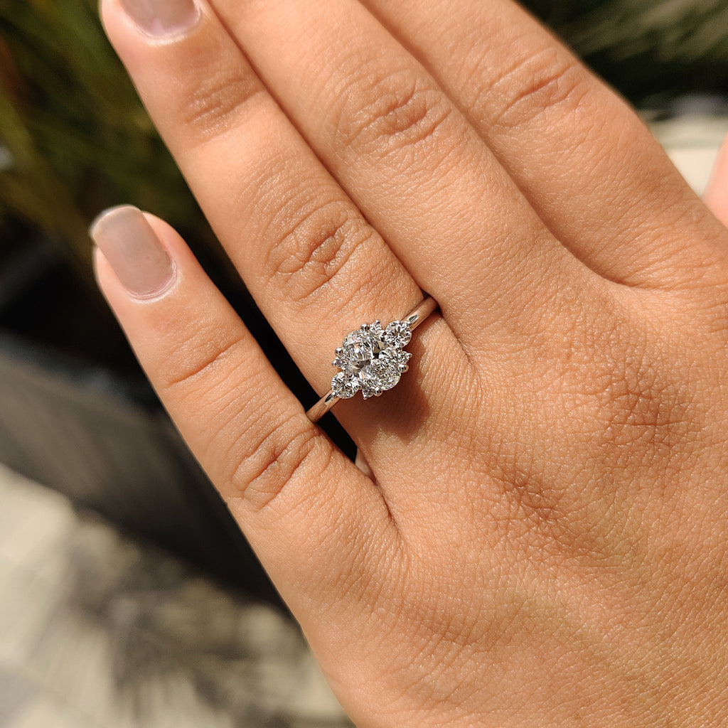 Oval Diamond Ring With Round Cut Side Stone