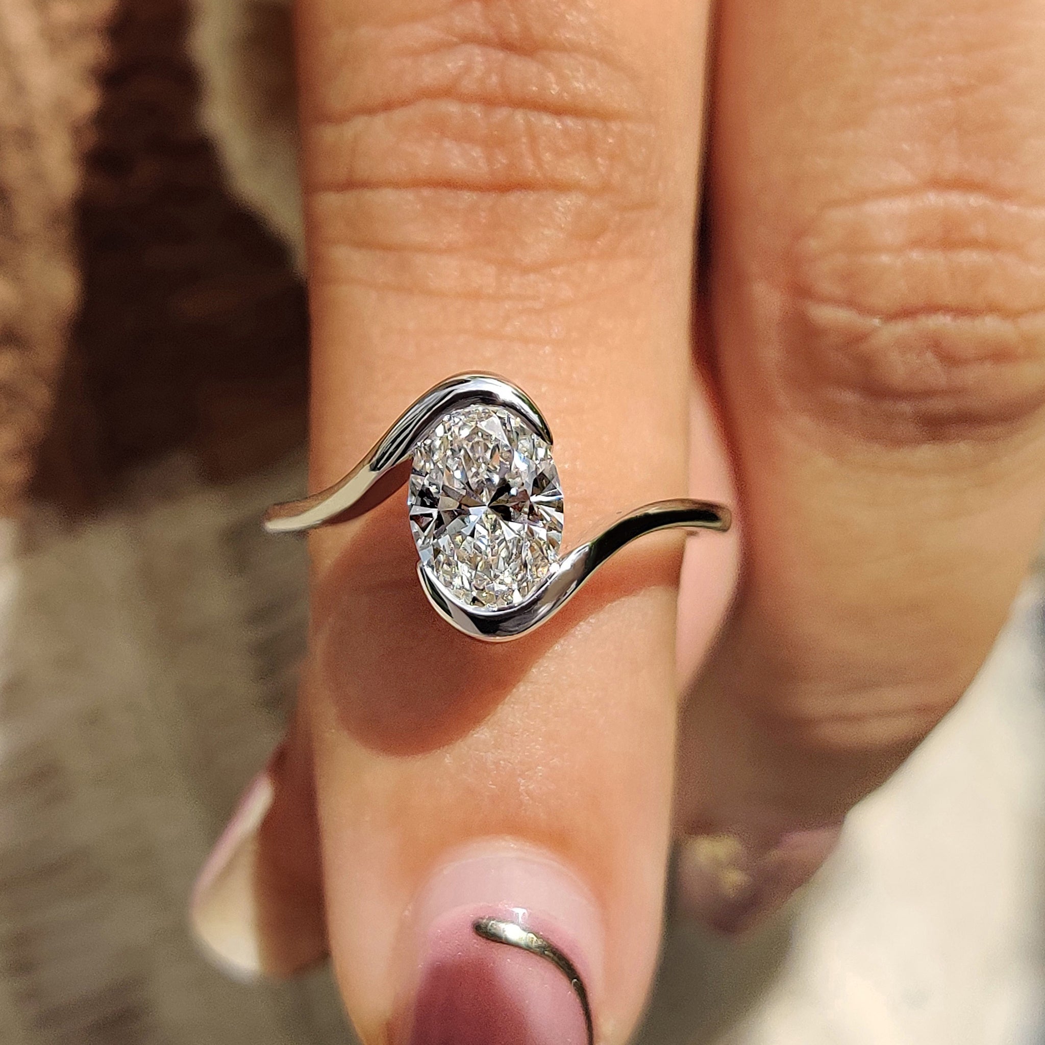Oval Diamond Engagement Ring In Half Bezel Setting Main image