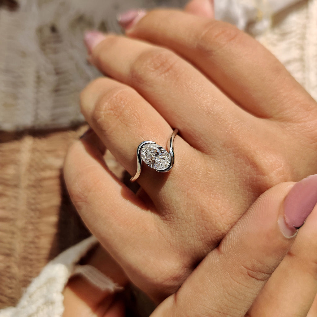 Oval Diamond Engagement Ring In Half Bezel Setting