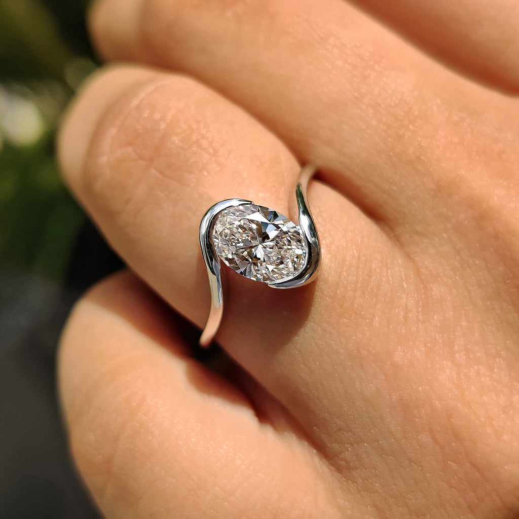 Oval Diamond Engagement Ring In Half Bezel Setting