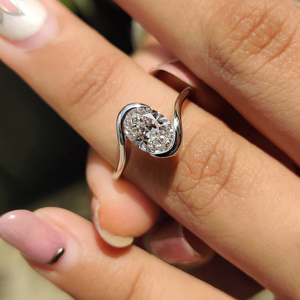 Oval Diamond Engagement Ring In Half Bezel Setting
