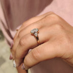 Oval Bezel Engagement Ring With Trillion Side Stone