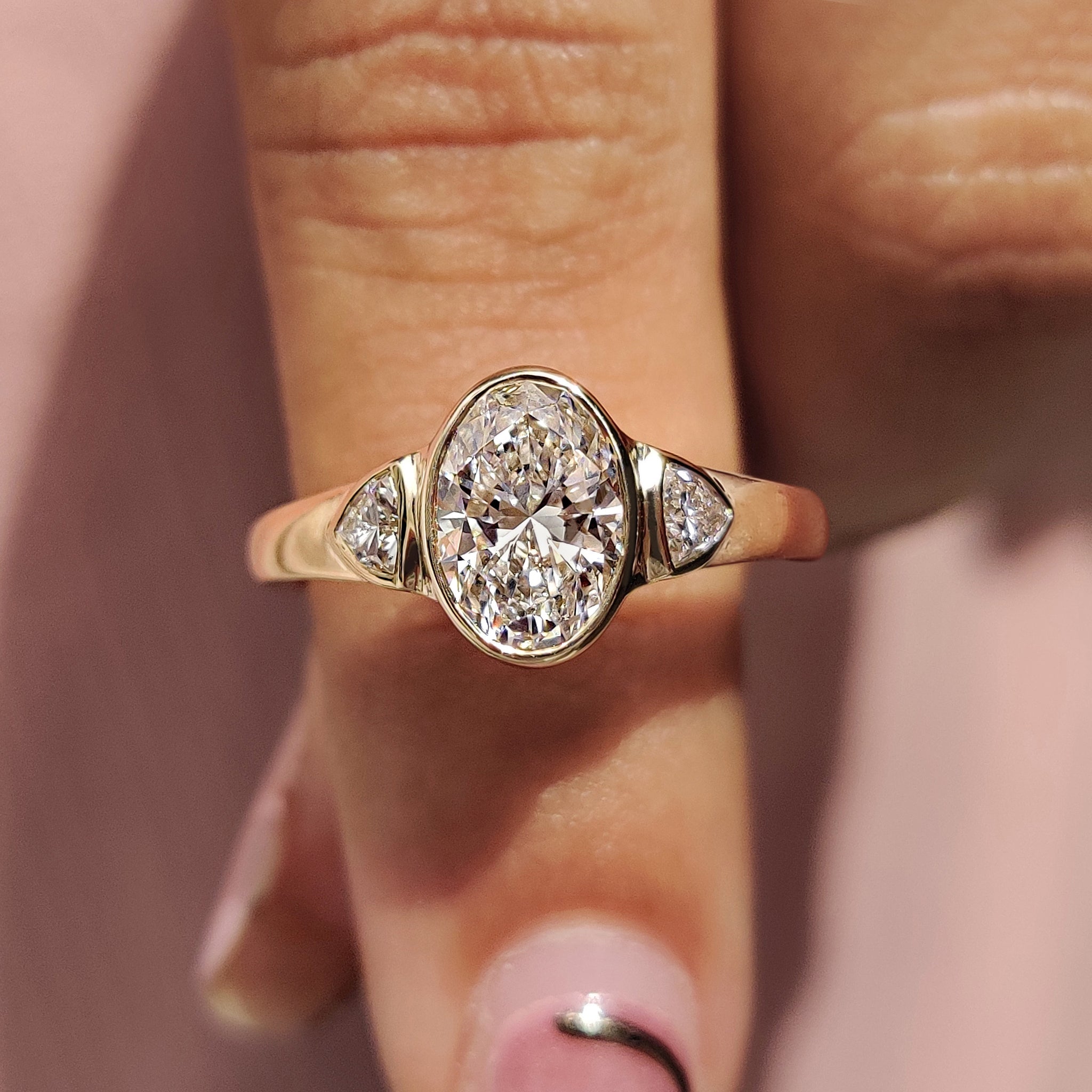 Oval Bezel Engagement Ring With Trillion Side Stone
