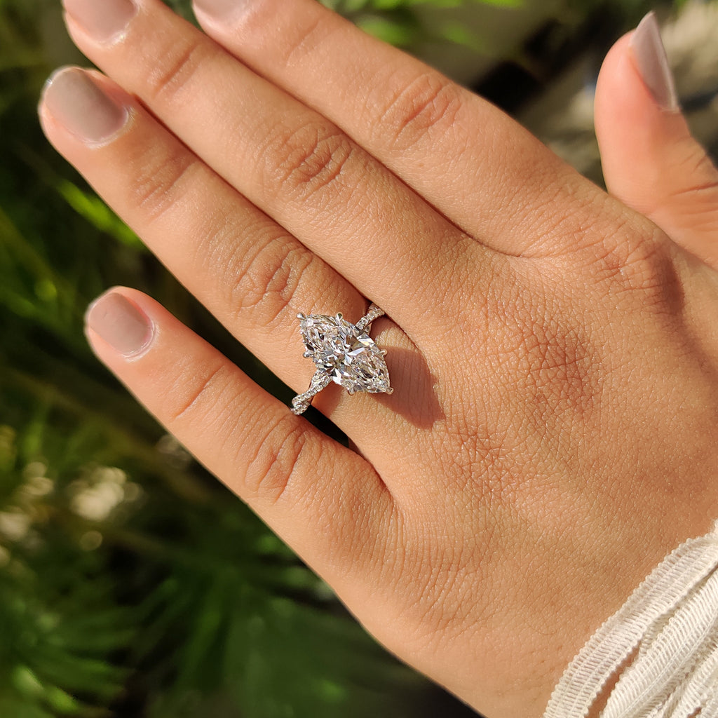 Marquise Cut Engagement Ring With Twisted Pave Band