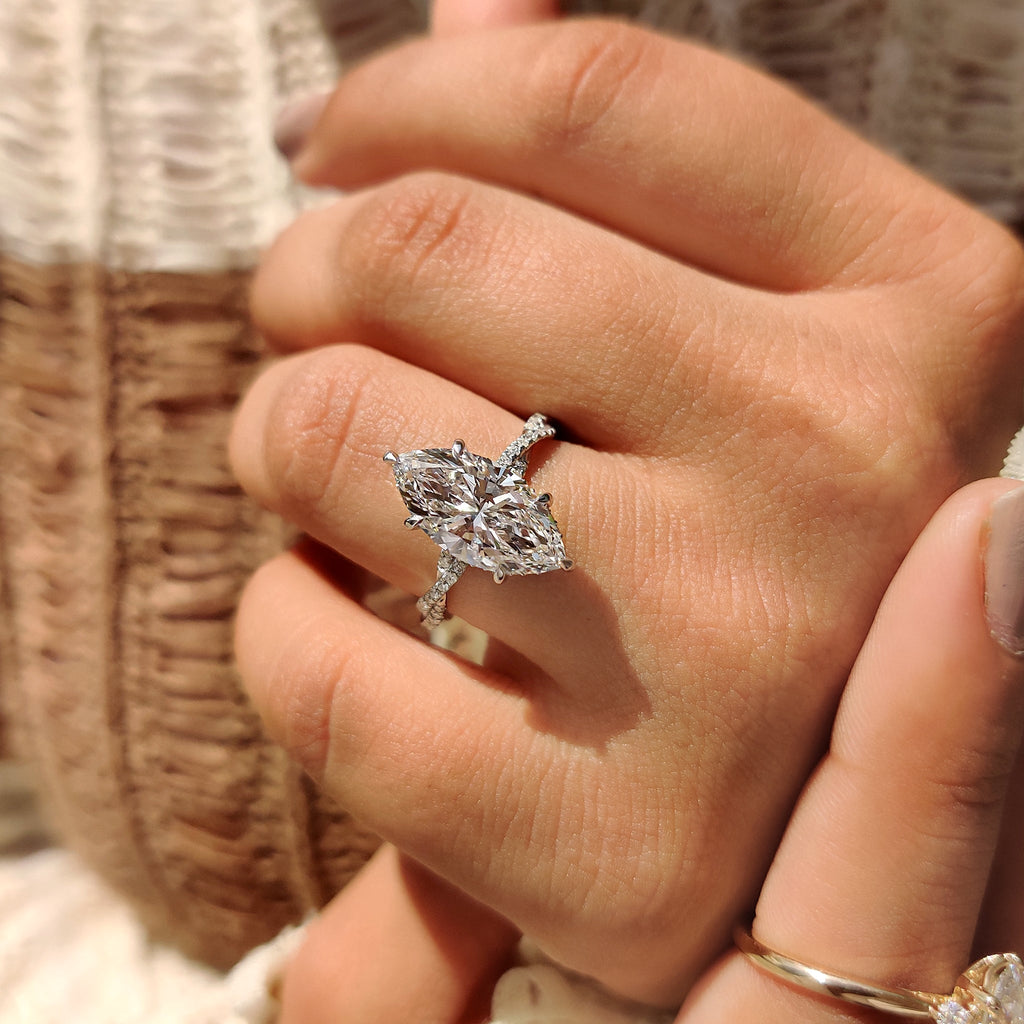 Marquise Cut Engagement Ring With Twisted Pave Band