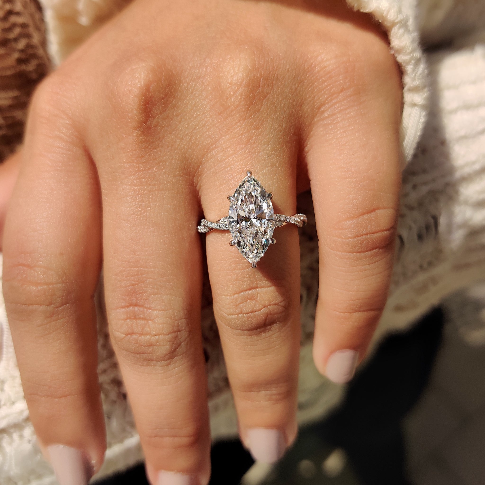 Marquise Cut Engagement Ring With Twisted Pave Band