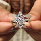 Marquise Cut Engagement Ring With Twisted Pave Band