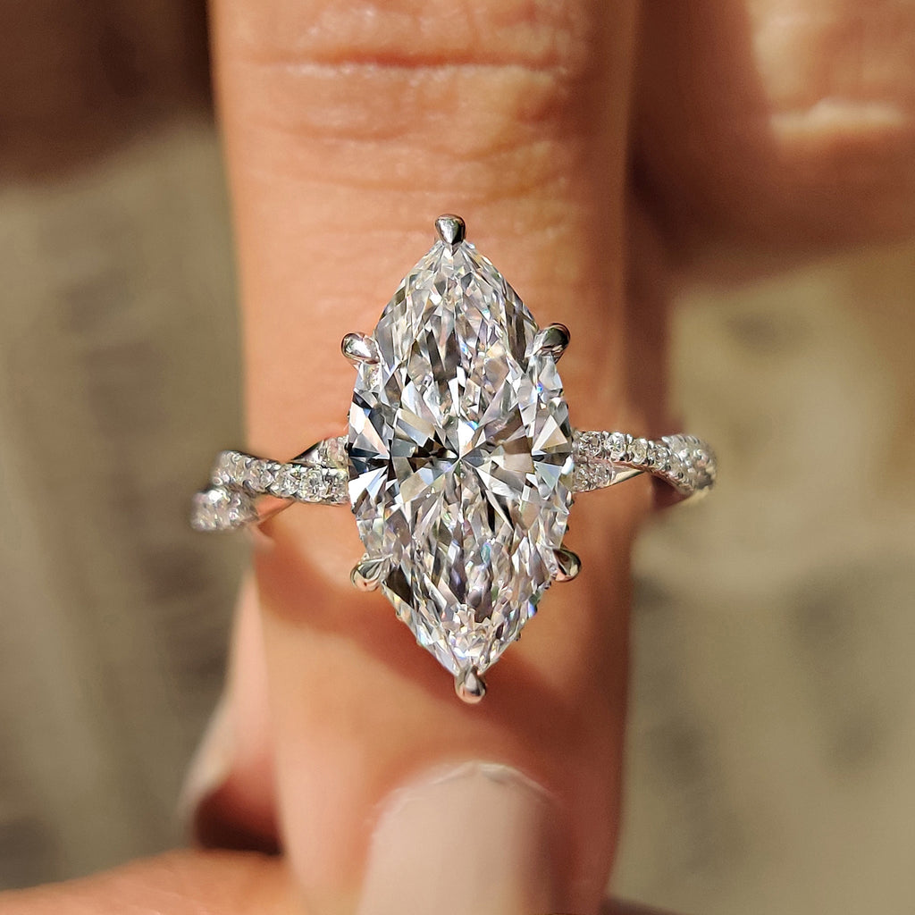 Marquise Cut Engagement Ring With Twisted Pave Band