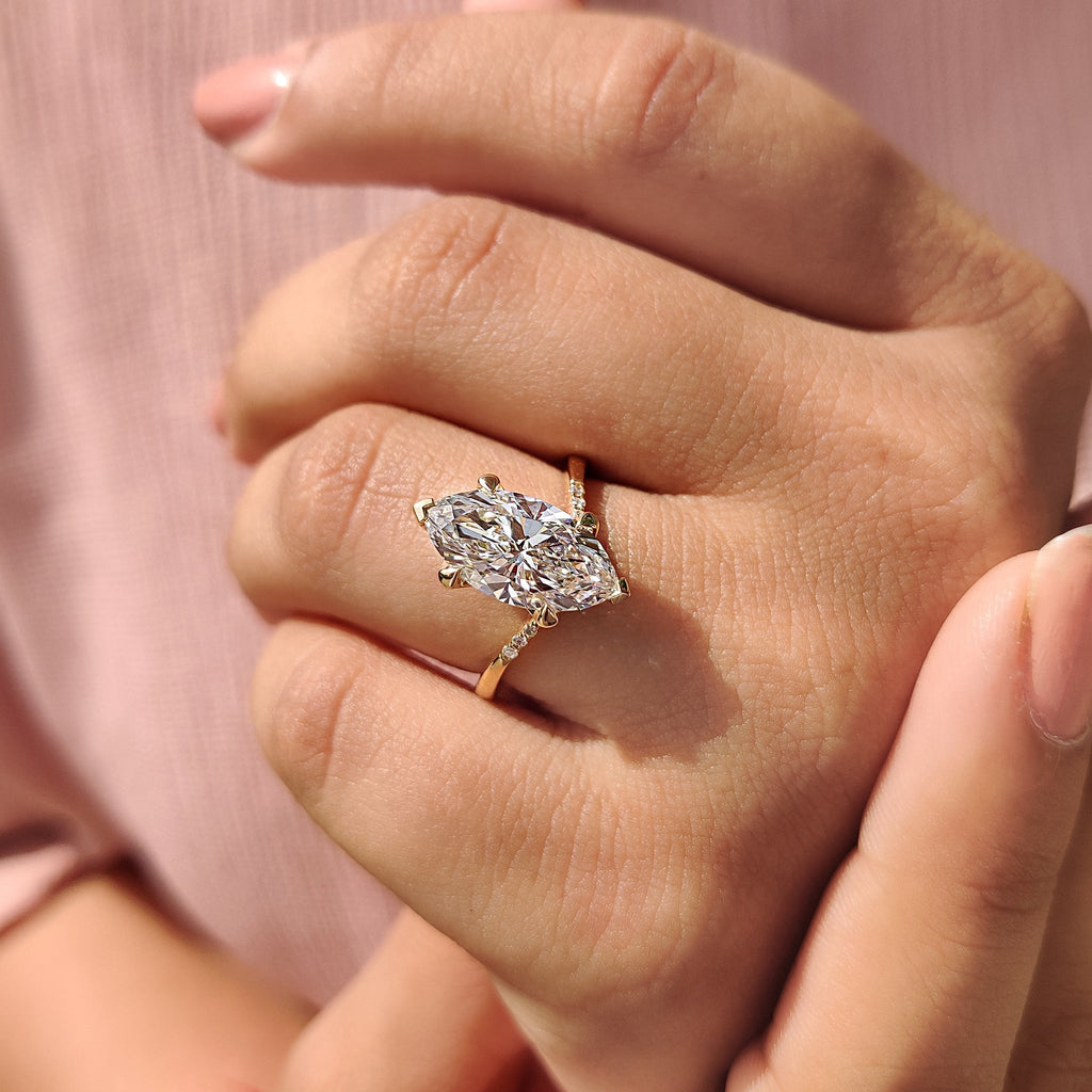 Gold Marquise Engagement Ring With Tapered Shank Band