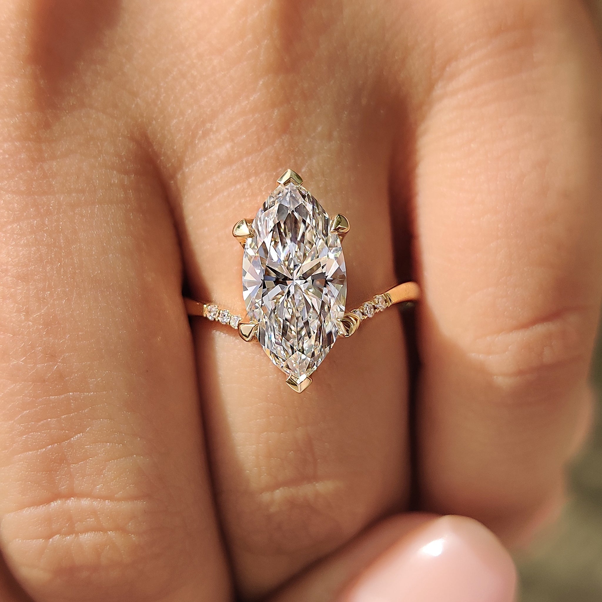 Gold Marquise Engagement Ring With Tapered Shank Band